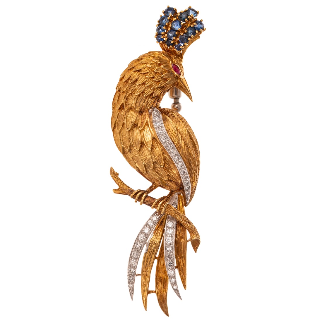 A Ben Rosenfeld Diamond & Gemstone Phoenix in 18K: 18K yellow gold phoenix brooch by Ben Rosenfeld, London (active 1959 - 1987), featuring a highly textured feathered body with sapphires set in crown, ruby eyes and diamonds in tail, signed "BRLD," 4