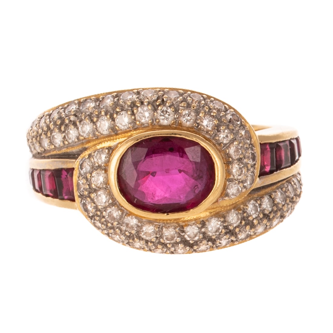 A Ruby & Diamond Swirl Ring in 18K: 18K yellow gold ring featuring an oval cut ruby 6.5 x 8 mm bezel set, with round diamonds pave set in a swirl, and graduated square cut rubies channel set on each shoulder, sz 8, 8.0 grams Provenance: