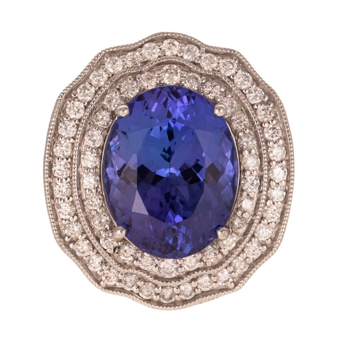 A GIA 7.97 ct Tanzanite & Diamond Ring in Platinum: Platinum ring by Oscar Friedman featuring an oval tanzanite weighing 7.97 carats, accompanied by GIA Gemological Report #5231255297, prong set in the center of a double halo of round diamonds shared p