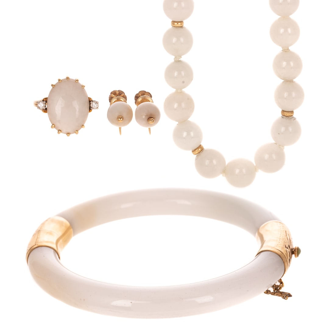 A White Jade Demi Parure in 14K: 14K yellow gold white jade demi parure including 1) Jade bead necklace, 8.5 mm, with evenly spaced gold beads throughout, hook and clasp, 17 1/2 in. L, 2) Jade ring with oval cabochon measuring 16 x 1