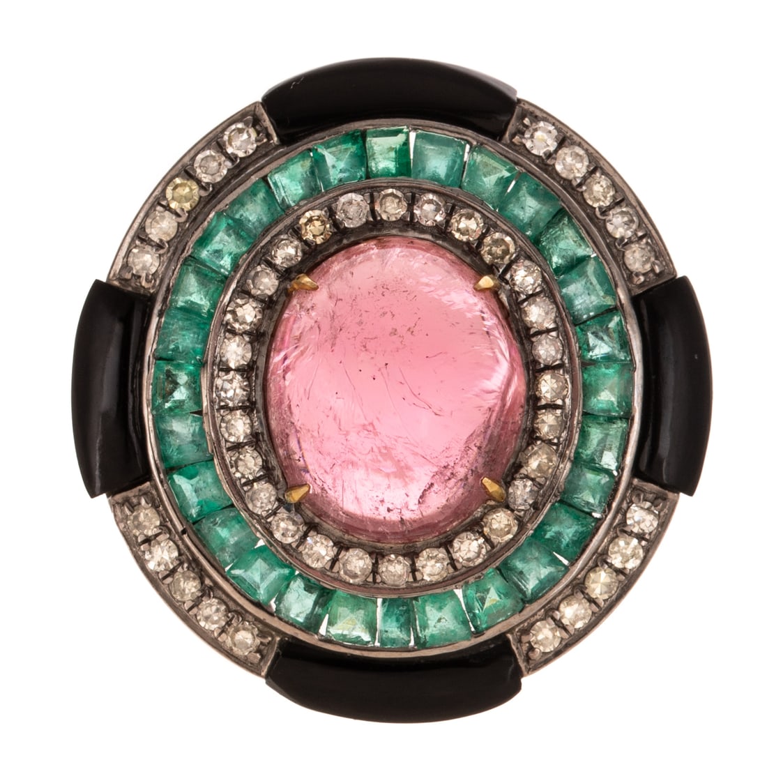 A Tourmaline, Emerald, Diamond & Onyx Ring in Sterling Silver: Sterling silver ring featuring a oval shaped pink tourmaline cabochon measuring 13 x 11 mm prong set in the center of three concentric halos consisting of round diamonds bead set, square and tapered e