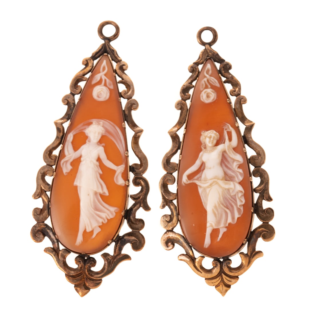 A Pair of Rococo Revival Cameo Earring Jackets in 14K: 14K yellow gold Rococo Revival earring jackets featuring carved shell cameos with maidens and floral detail, bezel set with S-scroll border, 2 1/2 in. L, 13.8 grams Provenance: From a Baltimore estate