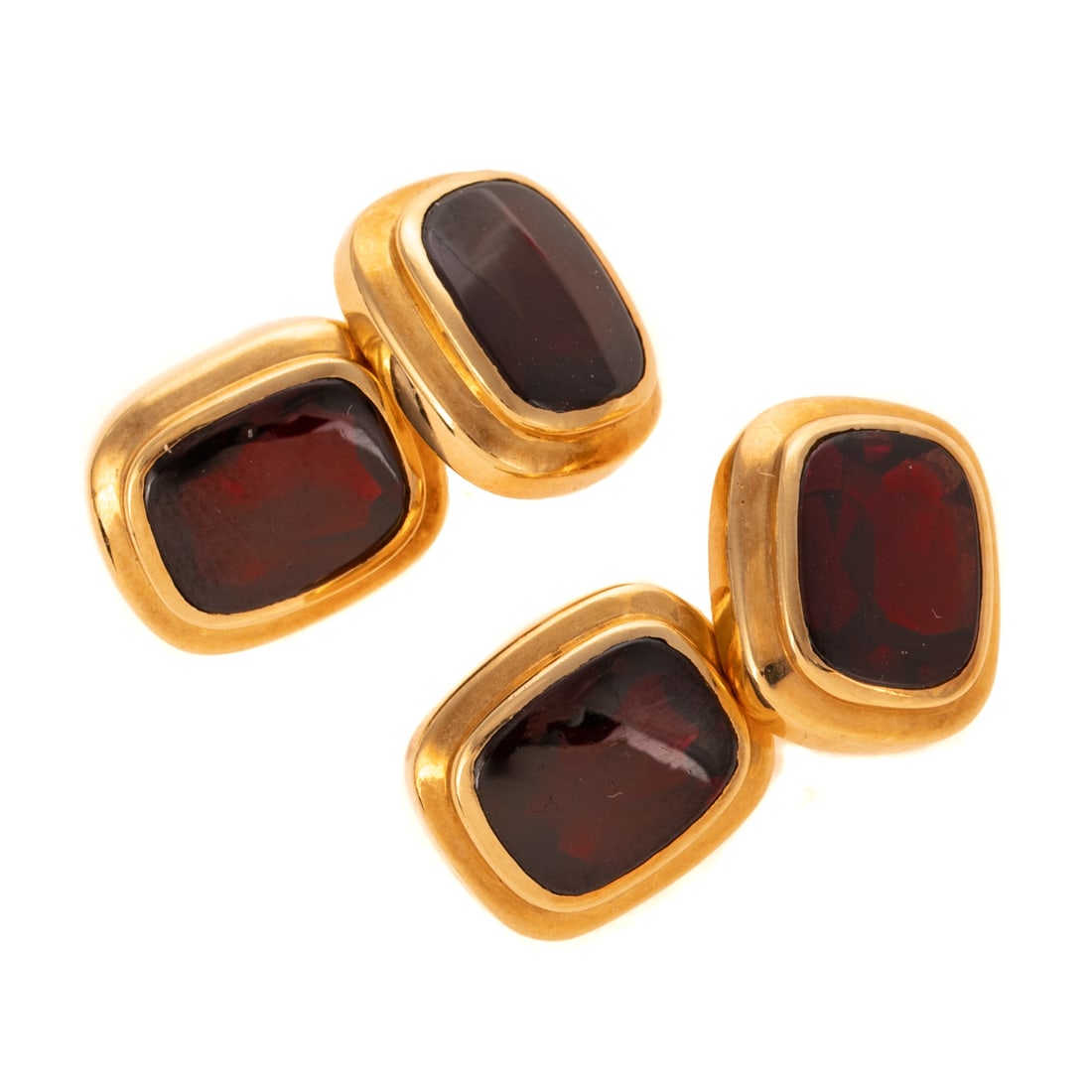 A Pair of Cartier Garnet Cufflinks in 18K: 18K yellow gold Cartier cufflinks featuring bezel set custom cut cushion shape garnets with chain connector, serial #220, signed, 14.7 grams along with original Cartier box