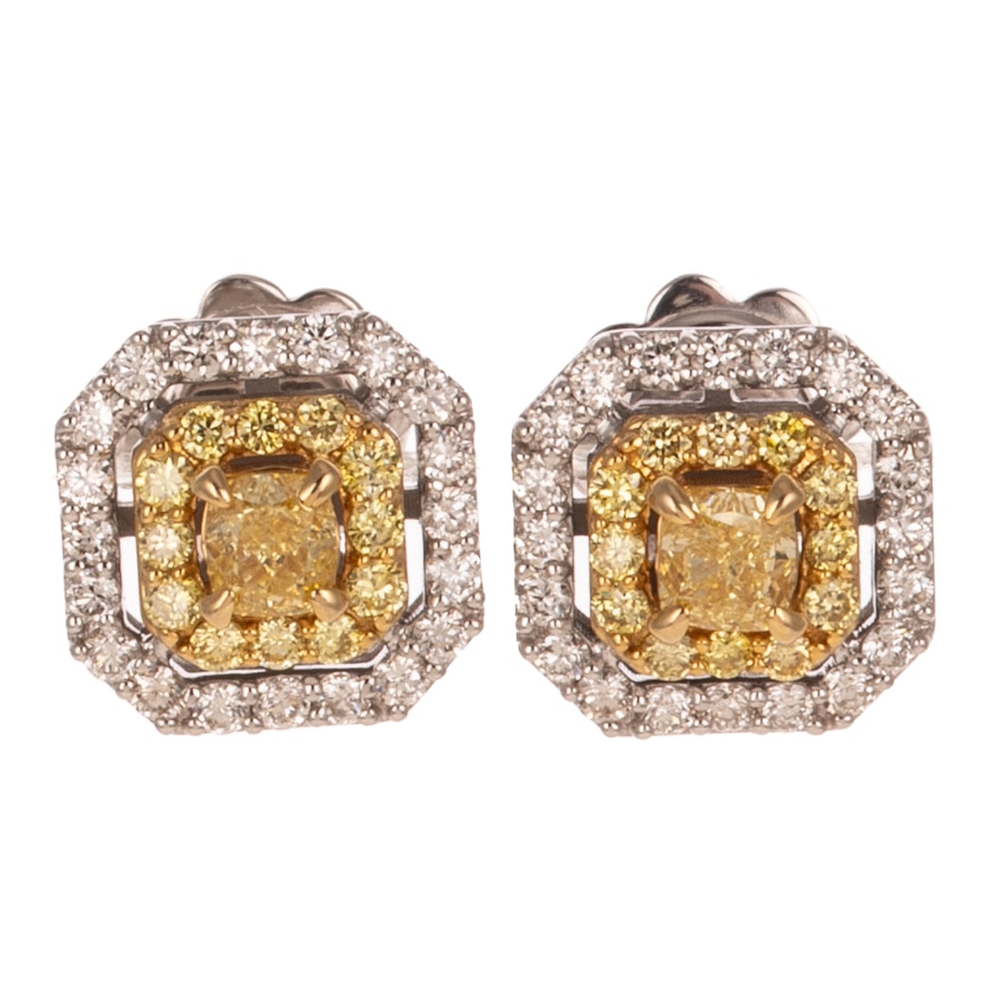 A Pair of Yellow Diamond Halo Earrings in 18K: 18K white gold earrings featuring cushion cut yellow diamonds prong set in the center of a round yellow diamond halo with an outter halo of round white diamonds, all diamonds weighing approx. 1.00