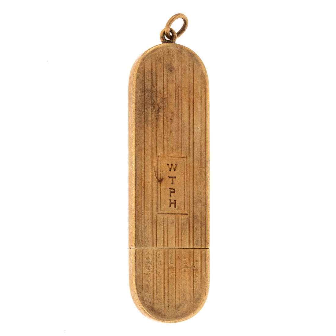 A Tiffany & Co Key & Cover in 14K: 14K yellow gold two part elongated oval pendant with engine turn engraving and monogram on front, pendant slides open to reveal a key, signed, 2 in. L, 14.4 grams tw Provenance: From a family estate i