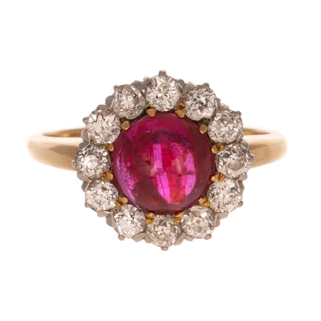 A Ruby & Diamond Dinner Ring in 14K: 14K yellow gold ring featuring a fine ruby cabochon measuring 6.9 mm Diam., with a halo of Old European cut diamonds and two round diamonds weighing approx. 0.60 ctw, shared prong set, sz 4.5, 3.6