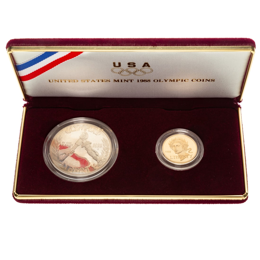 1988 Two-Coin Olympics Set with $5 Gold: To honor the 1988 Olympics and packed in the red Olympics box and case with COA. $5 gold is .2419 troy oz. Provenance: From the Estate of Thomas J. DePrince, Rehoboth, DE