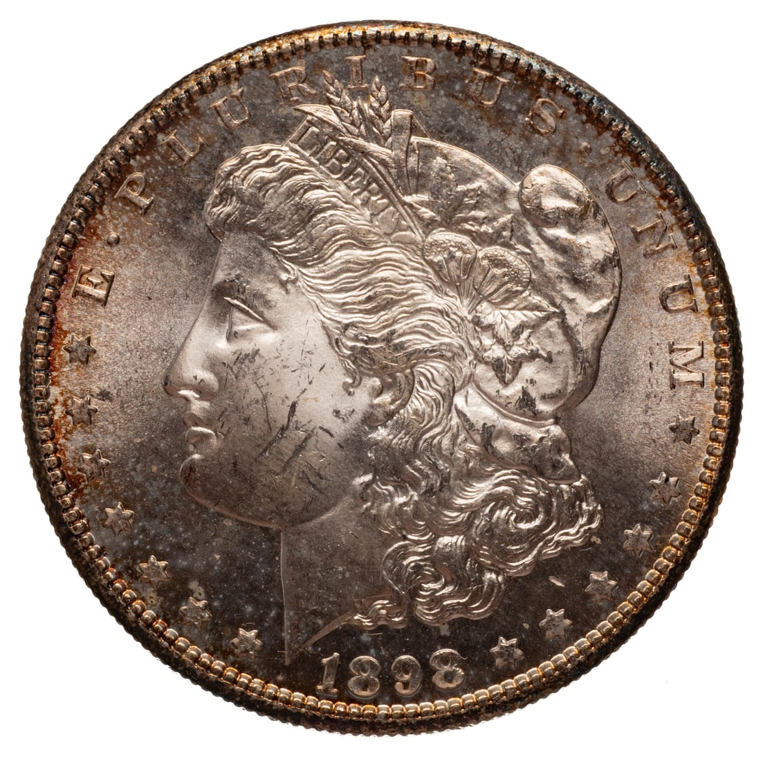 1898-S Morgan MS62+: A few facial ticks prevent an easy MS63 while the reverse is 63/64 sitting in a sea of semi proof-like glow with amazing luster on both sides. Provenance: Lifetime numismatic property of a long time