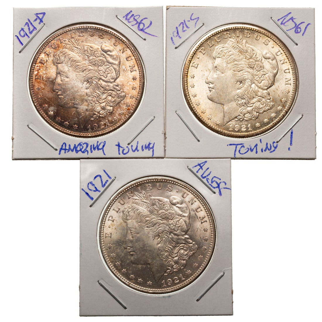 Three Coin 1921 Dollar Set - Great Toning on Two: 1921 AU48 with nice luster, 1921-D MS62 with rainbow album toning and strong luster, 1921-S MS61 with beginnings of album toning Provenance: Lifetime numismatic property of a long time Baltimore