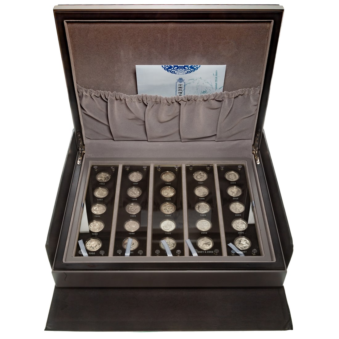 25th Anniversary China's Issuance of Silver Pandas: 25th Anniversary of China's Panda Silver Commemoratives. 25 1/4oz silver proof Pandas from 1982--2007. A stunning set, well packaged, each five-year group is sealed in Capital type holders. A product
