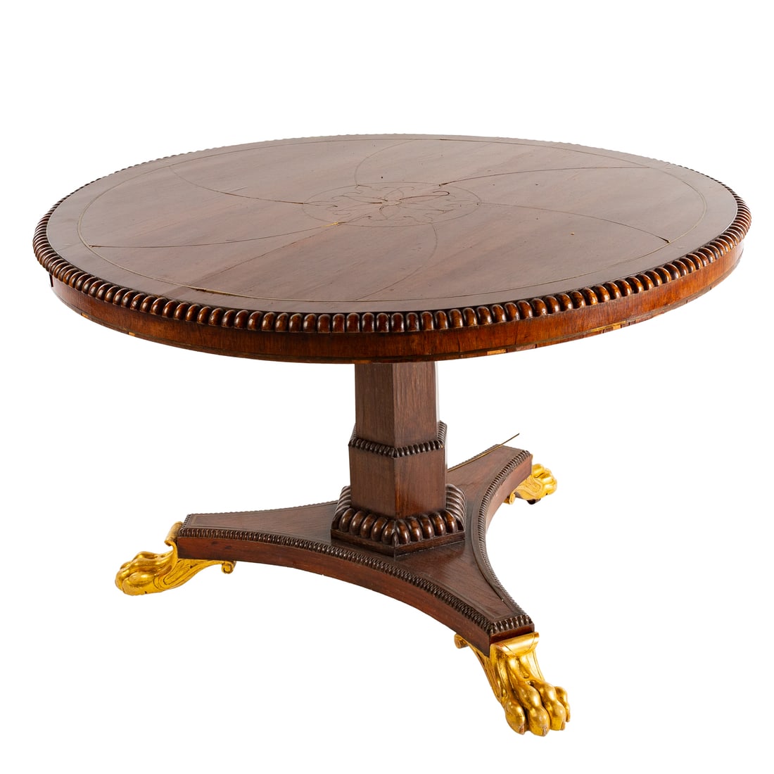 Regency Style Brass Inlaid & Mahogany Foyer Table: Circular brass inlaid mahogany top with beaded edge above a matching hexagonal pedestal on a triangular base ending in giltwood lion's paw feet, 30 in. H, 48 in. Diam. Provenance: From a private Delaw