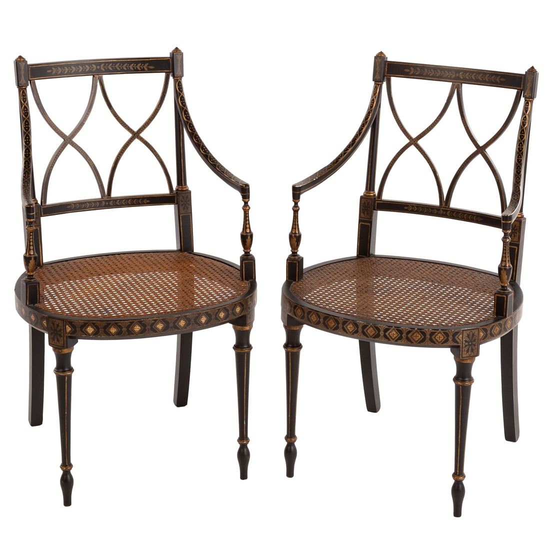 A Pair of Regency Style Painted Armchairs: Painted and gilt decorated frames supporting cane seats, 34 1/2 in. H, 21 in. W, 18 in. D Provenance: From a private Delaware estate/collector