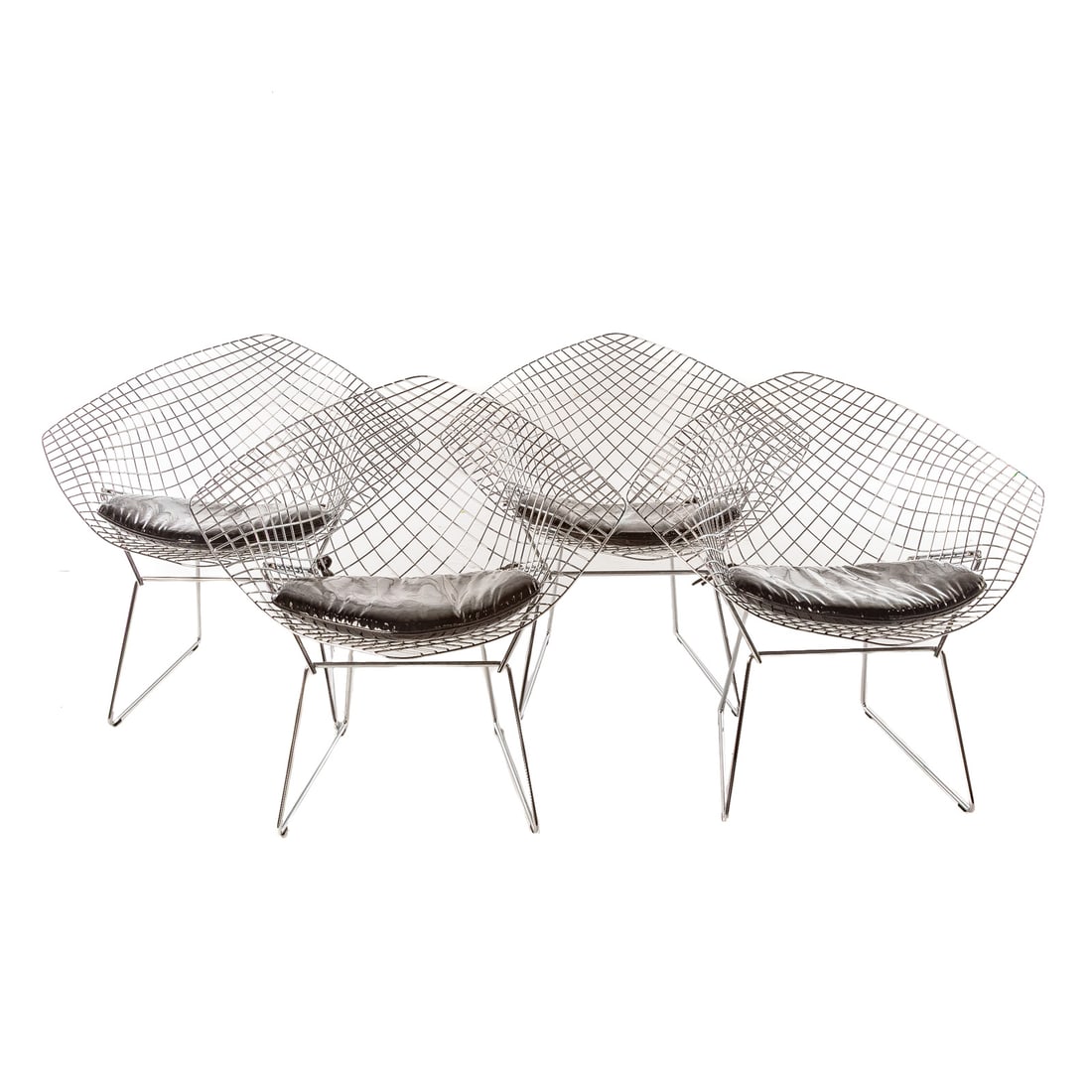 Four Harry Bertoia Diamond Chairs by Knoll: Chrome grid "diamond" frames with vinyl upholstered cushion seats, each: 29 1/2 in. H, 34 in. W, 31 in. D