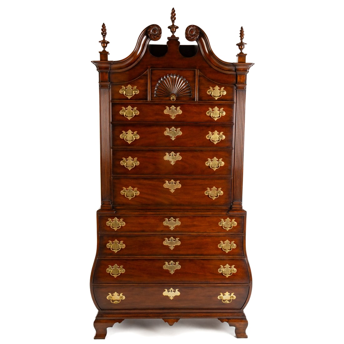Kittinger Colonial Williamsburg Chest on Chest: In the Boston manner, two part chest on chest, carved broken scroll pediment, topped by three flame and urn finials, over three over four drawer upper case flanked by fluted pilasters, the bottom