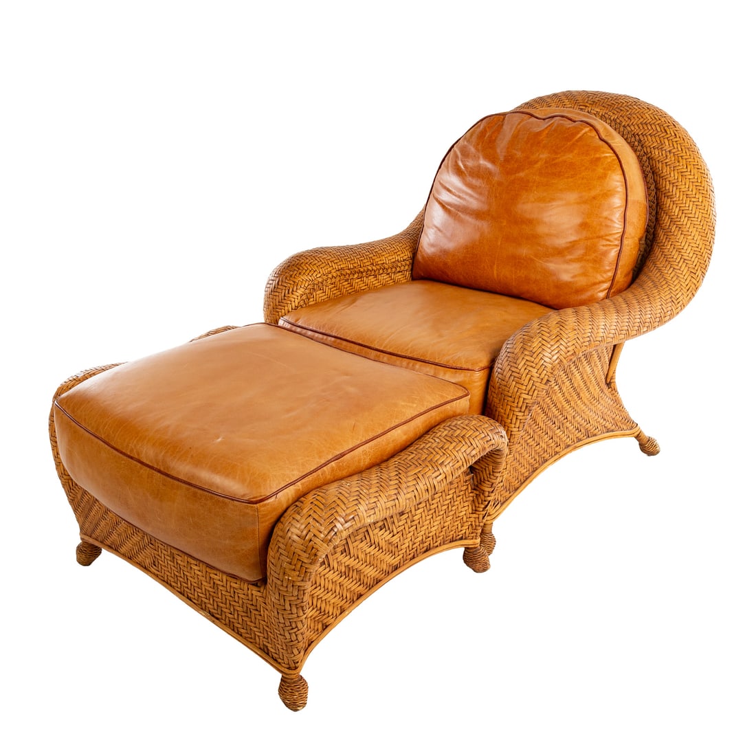 King Cobra Leather & Rattan Chair with Ottoman: Armchair with woven rattan frame supporting leather back and seat, 43 in. H, 42 in. W, 34 in. D; together with a matching ottoman, 22 in. H, 41 in. W, 26 in. D