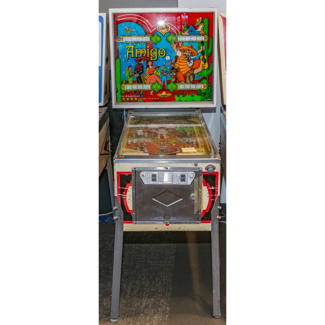 Bally's 1974 Vintage "Amigo" Pinball Machine: 70 1/2 in. H, 30 1/4 in. W, 54 in. D Provenance: From a Baltimore Collector, Known Locally as the "Pinball Wizard"