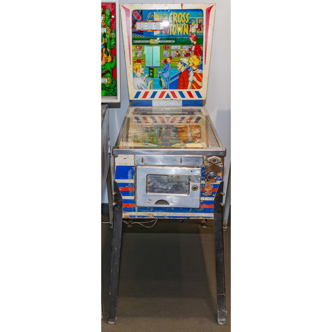 Gottlieb's Vintage 1966 Cross Town Pinball Machine: 69 in. H, 26 in. W, 54 in. D Provenance: From a Baltimore Collector, Known Locally as the "Pinball Wizard"