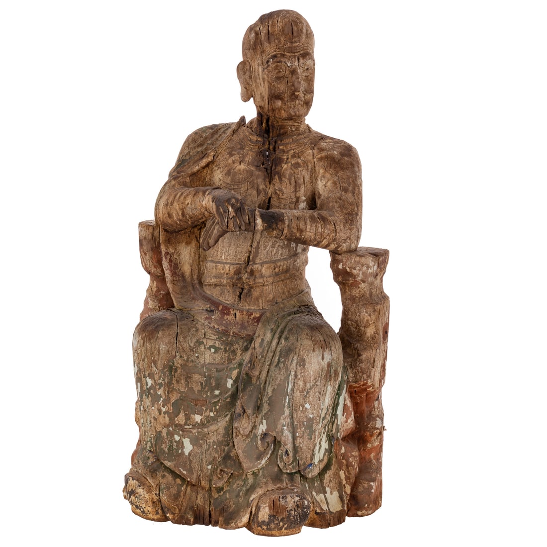 A Chinese Song Dynasty Style Wooden Luohan: A wood Chinese Song Dynasty style Luohan portrayed as an old man seated between two rocks with one hand held in the other, carved with compartments for prayers or relics in the head, chest, and base;
