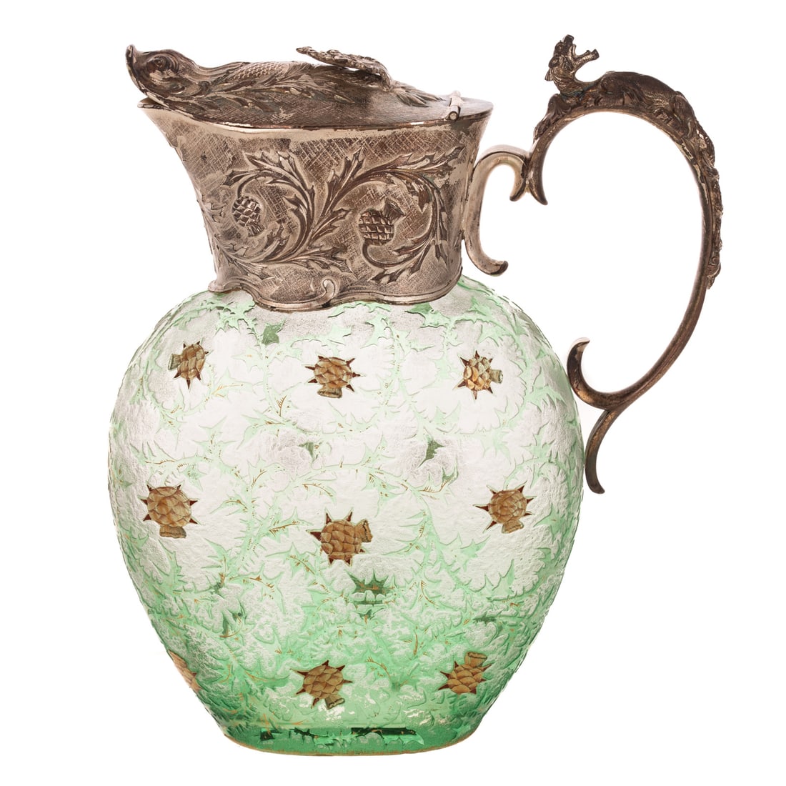 A Daum Nancy Silver Mounted Cameo Jug: A green Daum Nancy silver mounted jug with dragon form on handle and fish at spout, decorated in thistles highlighted in gold paint, marked "Daum Nancy" on the bottom and marked sterling, 8 1/2 in.