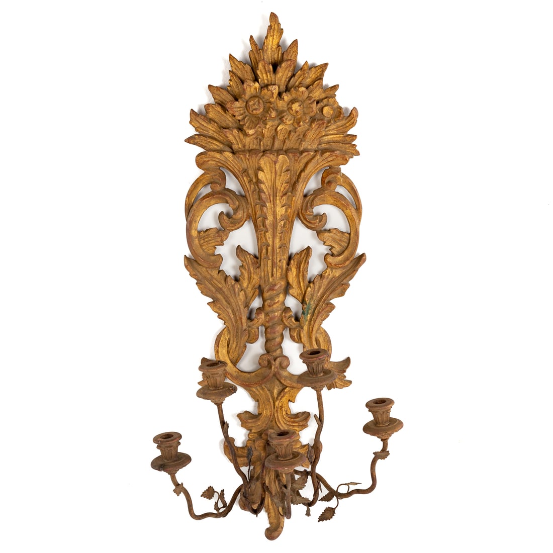 A Giltwood Four-Light Wall Sconce: A giltwood wall sconce with metal four-light candle arms decorated with central bouquet and acanthus leaf carvings, 35 1/4 in. H, 16 in. W, 12 in. D Provenance: From a private Delaware