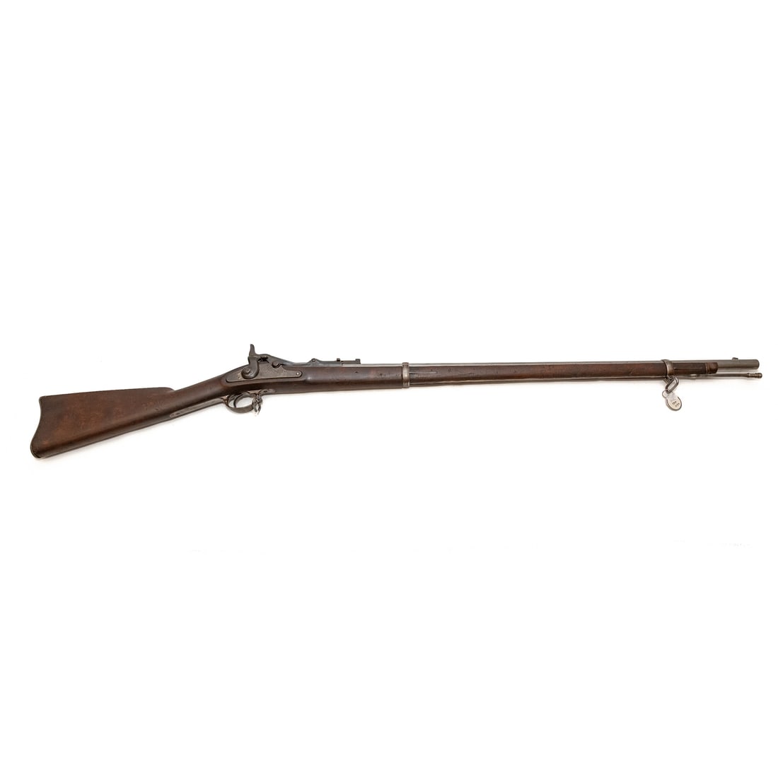 A Springfield Model 1868 Trapdoor Rifle: Converting the Model 1863 musket to a breech-loader, with updated breech lock and barrel; serial number 9068, marked on end of barrel and on the front of breach; .50/70 caliber; the barrel, 32 1/2 in.