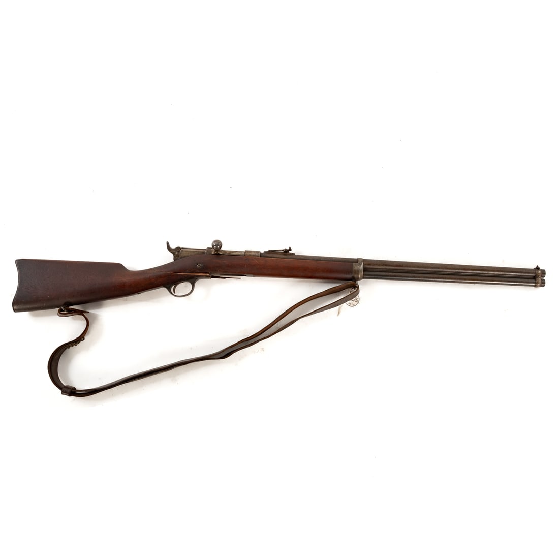 A Remington Keene Model 1880 Rifle: The first bolt-action rifle produced by Remington, fitted with a tubular magazine under the barrel; .45/70 caliber; the barrel, 25 in. L; leather shoulder strap, of the period; marked "E. Remington & 