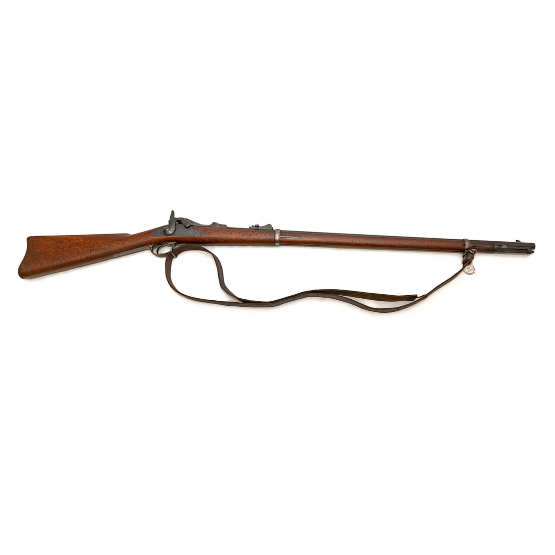 A Springfield Model 1873 Trapdoor Rifle: Serial number 157823, marked on top of receiver; .45/70 caliber; 32 in. L, barrel; regulation bayonet; leather shoulder strap of the period; lock plate marked "U.S. Springfield," with American eagle;