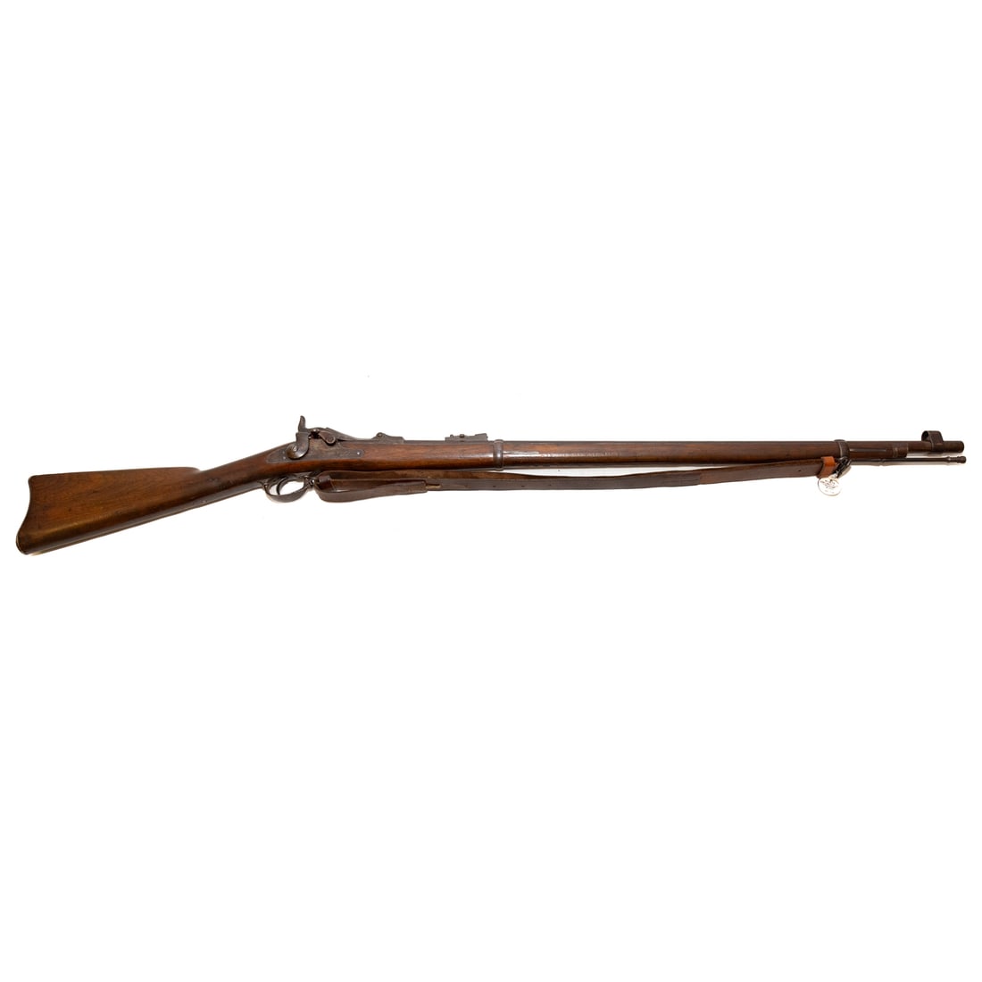A Springfield Model 1873 Trapdoor Rifle: Serial number: 55349, stamped on receiver; .45/70 caliber; the barrel, 32 1/2 in. L; flip-up rear sight and hooded front sight; leather shoulder strap of the period bearing inspector's stamp; lock pla
