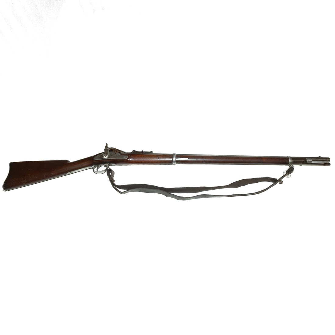 A Springfield Model 1870 Trapdoor Rifle: No serial number, converted from a Model 1863 musket with breech-loading receiver and new barrel; .50/70 caliber; the barrel, 32 1/2 in. L; leather shoulder strap of the period; the lock plate stamped