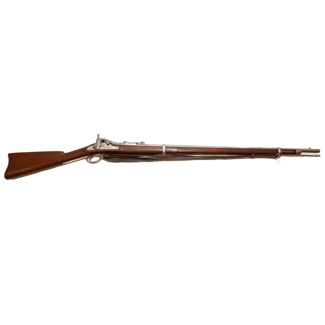 A Springfield Model 1868 Trapdoor Rifle: Serial number 11464, on barrel and on left side of receiver; converted from a Model 1863 musket, .50-70 caliber; the barrel, 32 in. L; tip-up sight at back, bead at front; Watervliet Arsenal leather s