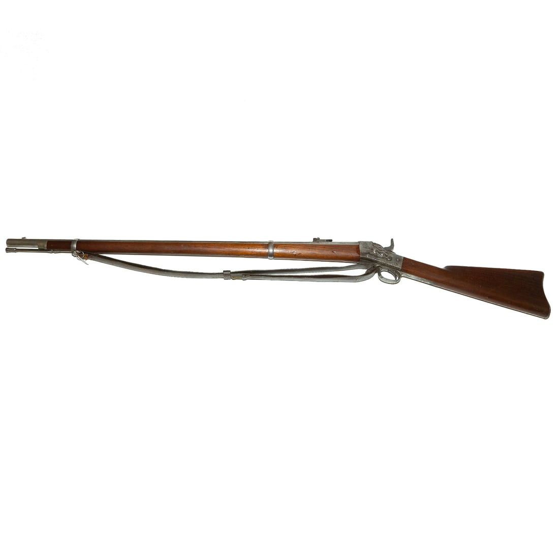 A Springfield Remington Model 1871 Rolling Block: No serial number evident, .50-70 caliber; the barrel, 36 in. L; remnant of leather shoulder strap; the lock plate marked "U.S. Springfield," with an American eagle, dated 1872; "Remington's Patent/ Pa
