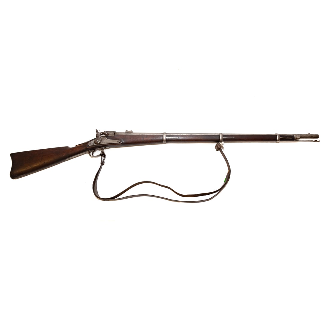 A Springfield Joslyn "Monkey Tail" Rifle: The first breechloader produced at the Springfield Armory, converting existing Model 1863 muskets, total production about 3000; .50-60 caliber; the barrel, 34 in., L; leather shoulder strap of the per