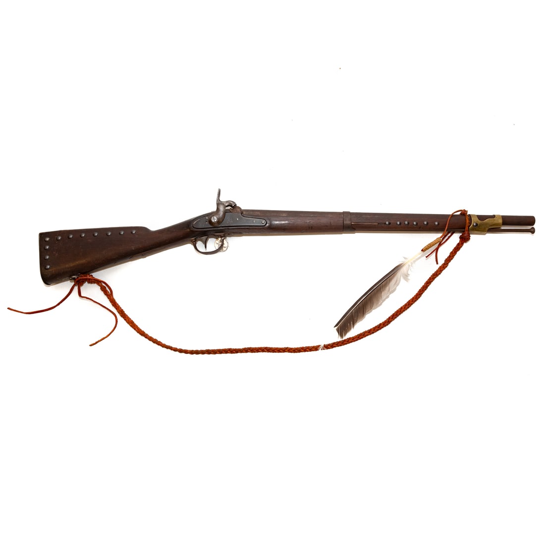A Springfield American Indian Trade Carbine Rifle: Model 1842, decorated with upholstery tacks and feather; .69 caliber; the barrel, 25 in. L; lock plate stamped "U.S.," below an American eagle; "Springfield 1849;" 41 1/2 in. L, overall Provenance: Fr