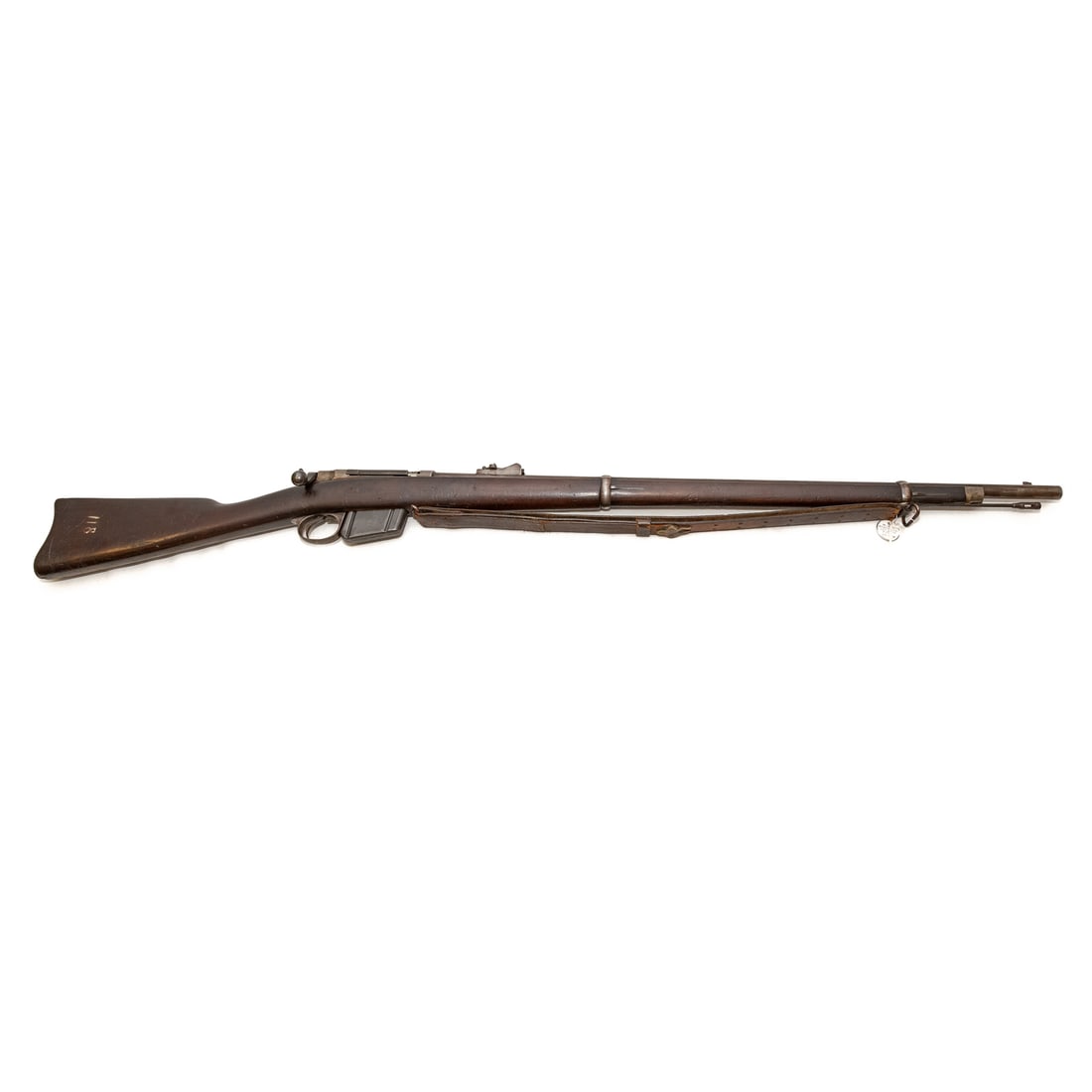 A Remington Model 1885 Navy Rifle: Serial number 52436 on top of receiver; one of between 3500 and 4000 purchased by the US Navy; bolt action, with detachable magazine; .45-70 caliber; leather shoulder strap; the barrel, 32 in. L.; top