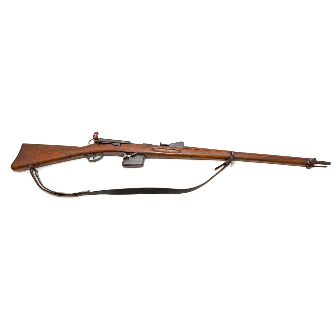 A Swiss Schmidt-Rubin Model 1889 Rifle: Serial number 24452, stamped on top of receiver, top back of barrel, and on magazine; 7.5X53.5 caliber; the barrel, 31 in. L; with a leather shoulder strap; proof marks stamped on top of butt plate, s