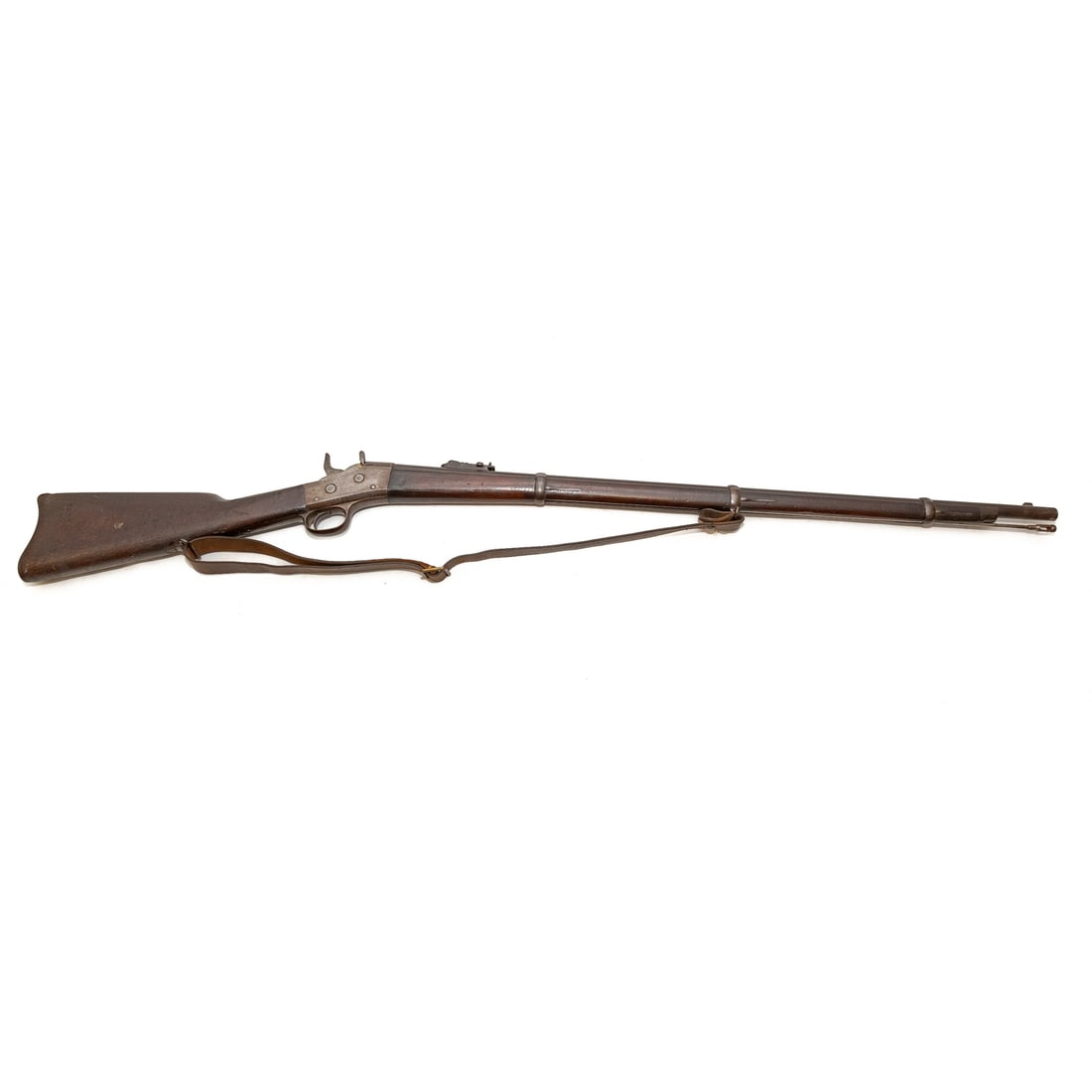 A Remington Spanish Model 1870 Rolling Block Rifle: Serial number 206620, on right side of butt stock; a rolling block breechloader; .43 caliber, Spanish bottleneck cartridge; the barrel, 35 in. L; with a leather shoulder strap; Proof marks on barrel b