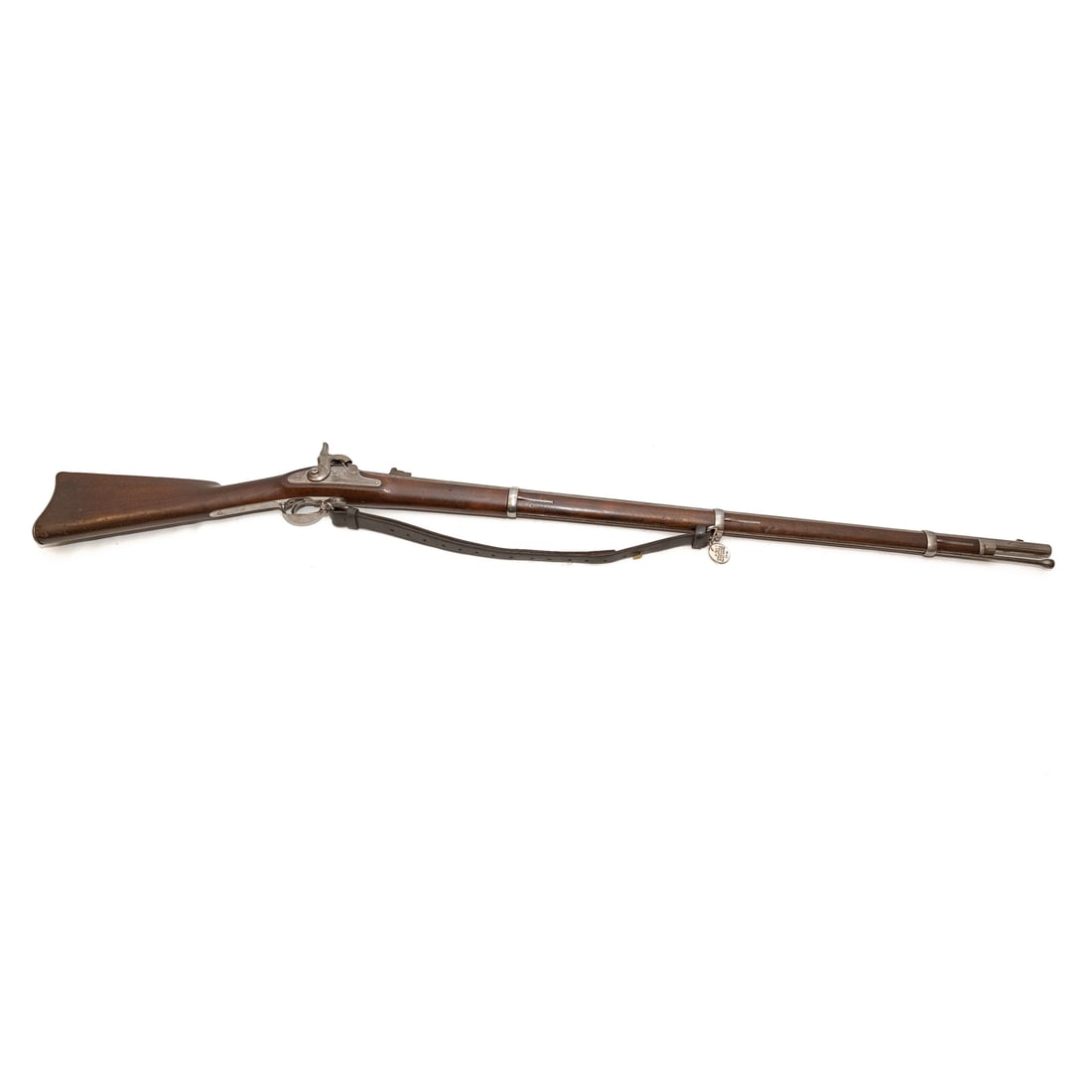 A Springfield Model 1863 Percussion Rifle: Dated 1866; .58 caliber; the barrel, 40 in. L; with leather shoulder strap; the lock plate marked "U.S. Springfield," with an eagle, to the front of hammer, also marked "1866," behind hammer; top of b