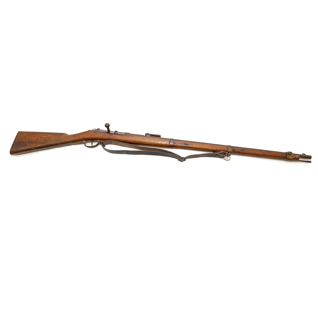 A German Model 1871 Mauser Rifle: Serial number: 71831, marked on bolt and slide, left side of receiver, and middle barrel band; 11x60R caliber; the barrel, 33 in. L; leather shoulder strap; marked "82," and "1879," on right of receiv