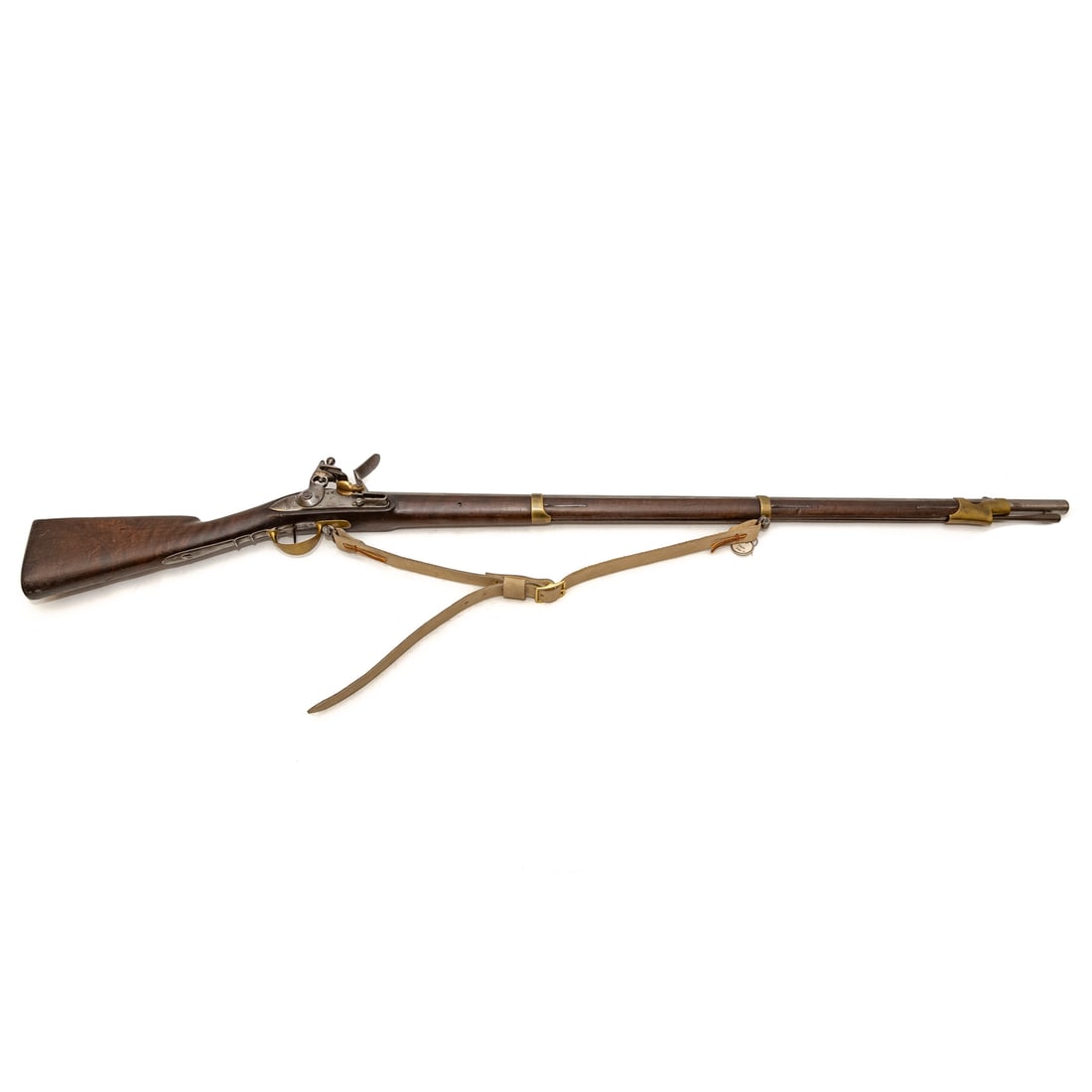 A Saint Etienne Model 1810 Flintlock Musket: .75 caliber; the barrel, 41 in. L; shoulder strap; the lock plate marked "MLE. RLE.. De Saint Etienne," proof marks on left side of barrel end, left side of brass, and on bottom metal strap; several n