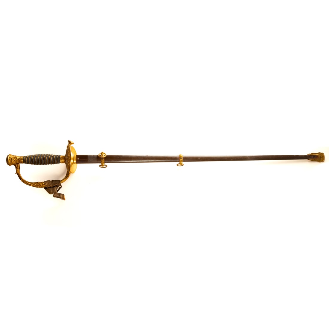 An American Model 1860 Officer's Sword: J. G. Minder (Baltimore, circa 1890) with elaborately etched blade, 30 in. L, with gilt brass handle, 36 1/2 in. L overall; the scabbard with gilt metal fittings and browned finish