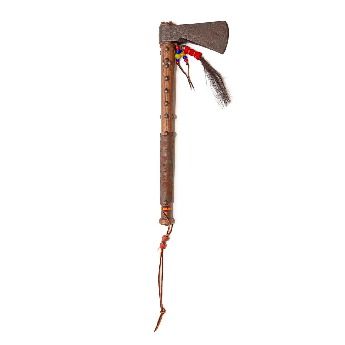 An Iron Head Tomahawk: Brass studded, American Indian trade style type, wrought iron; 17 3/4 in. L, overall length Provenance: From The Estate of Timothy Lee App, Baltimore, MD