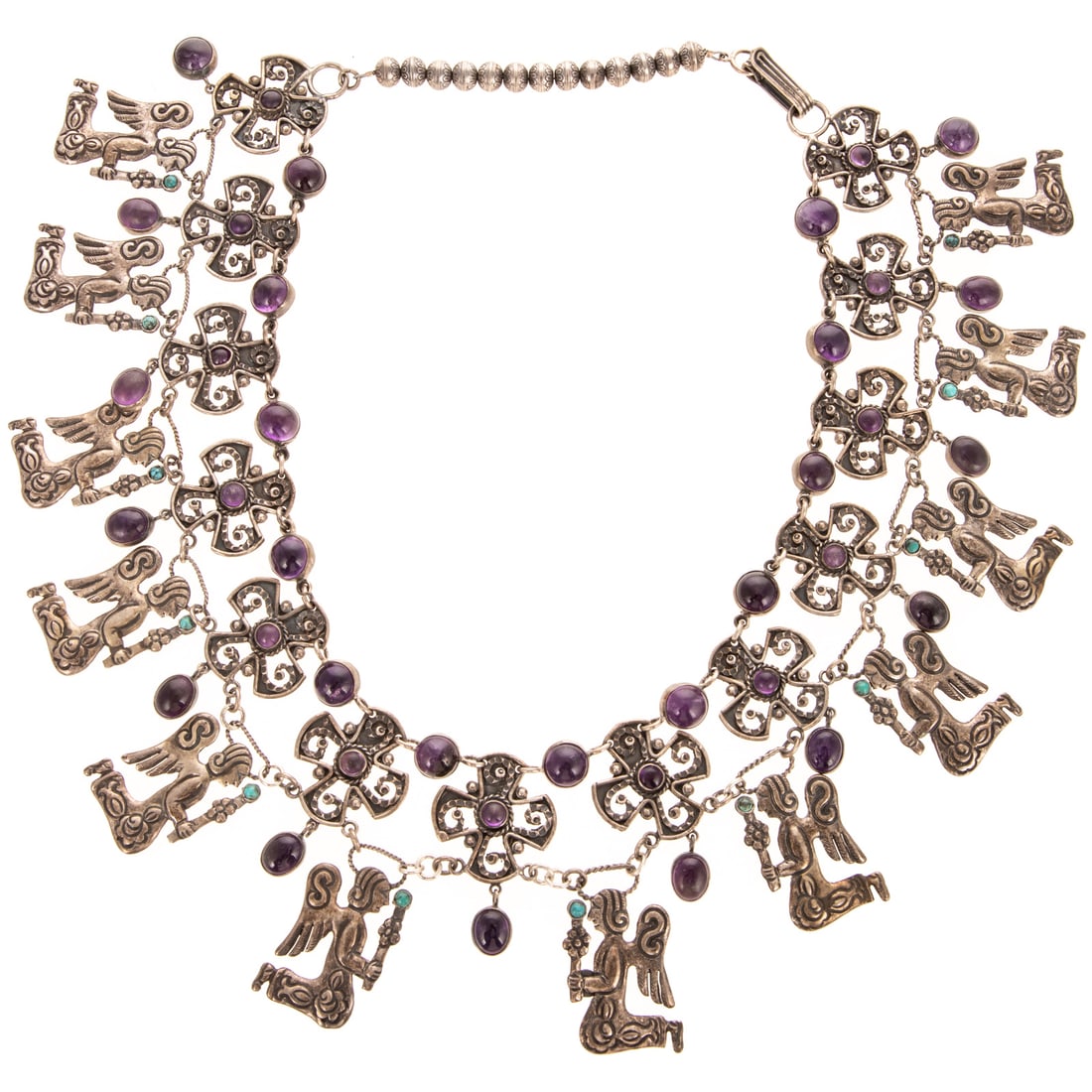 A Signed Angel & Cross Necklace in Sterling Silver: Sterling silver necklace by Carlos Gutierrez, Santa Fe, New Mexico designed with amethyst cabochons in scrolling cross links with dangling kneeling angels, engraved beaded back, hook clasp, 23 in. L, 