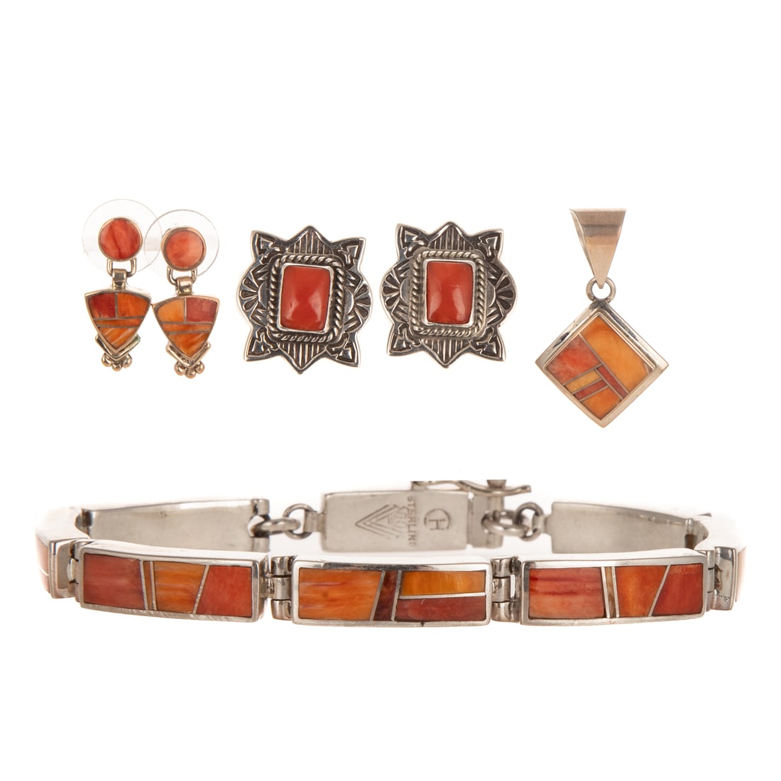 A Group of Navajo Jewelry by SuperSmiths & R. Willie in Sterling Silver: Sterling silver inlaid jewelry set by Navajo SuperSmiths Inc., New Mexico, each featuring spiny oyster and coral inlays, including 1) Bracelet with box clasp and safety latch, 7 1/2 in. L, 2) Pendant 