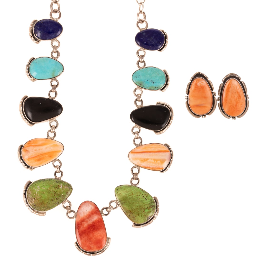 A Tom Long Navajo Inlaid Necklace & Earrings in Sterling Silver: Sterling silver and inlaid hardstone jewelry by Navajo artist Tom Long including 1) Necklace featuring free form polished lapis lazuli, onyx, green gaspeite, and spiny oyster, bezel set amid cable lin