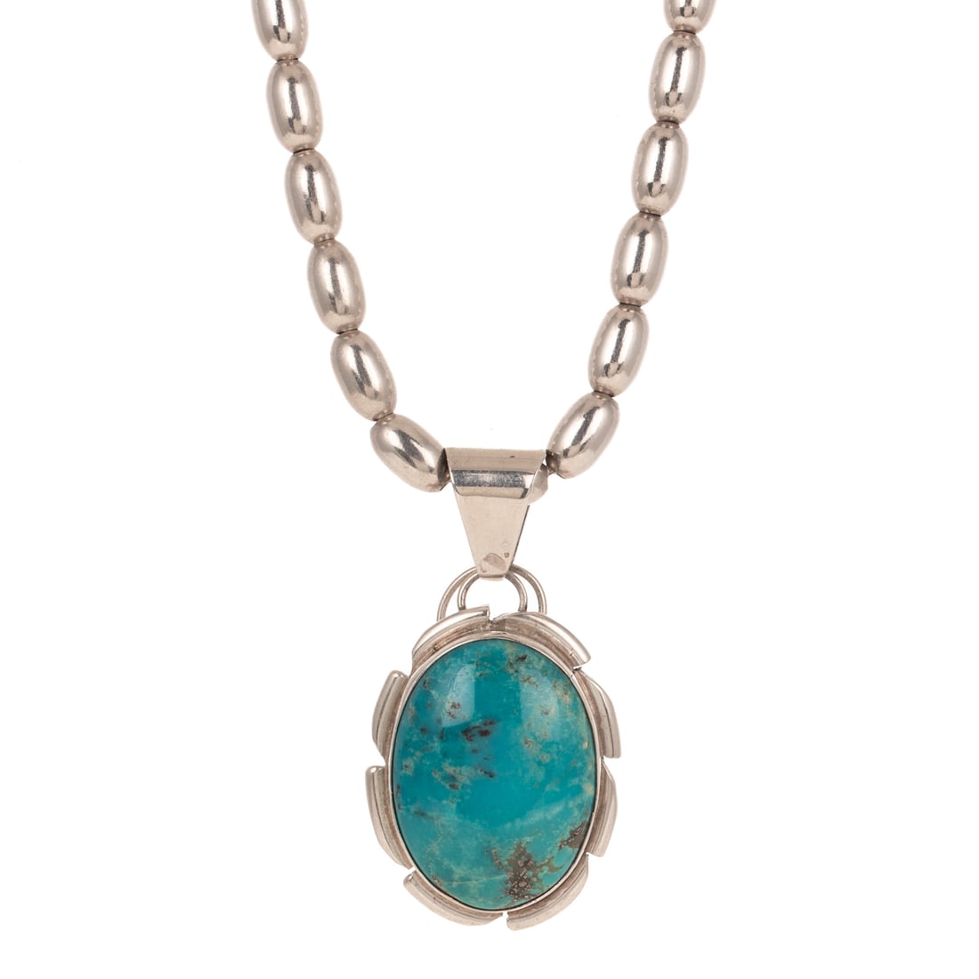 A Cecil Sanders Turquoise Pendant in Sterling Silver: Sterling silver turquoise pendant by Navajo artist Cecil Sanders, featuring an oval cabochon turquoise, 1 1/8 in. x 7/8 in. bezel set, signed, and suspended from an Italian sterling silver elongated b
