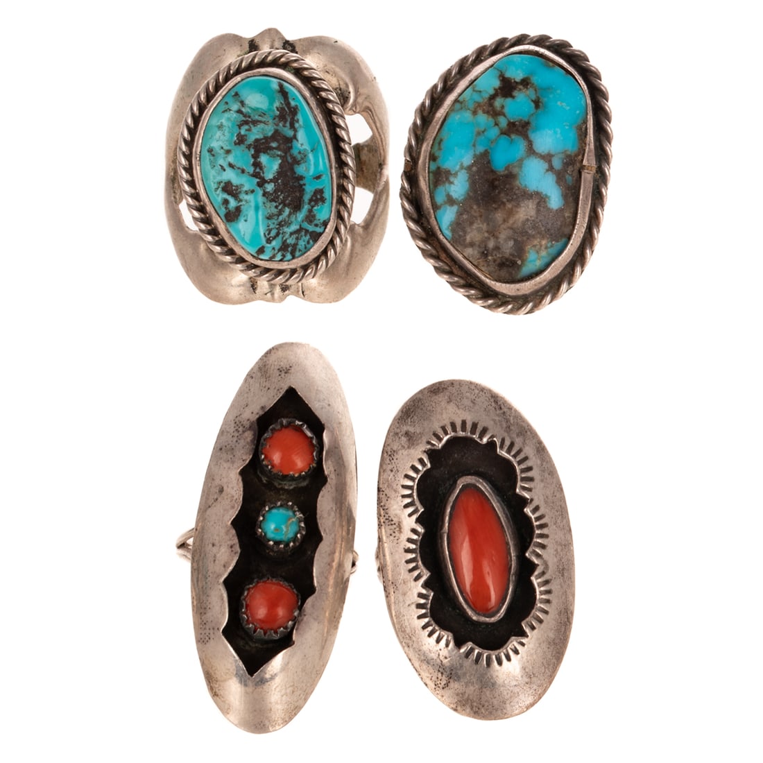 A Group of Four Native American Rings in Silver: 1) Silver ring attributed to Zuni artist Leonard Martza, featuring an elongated oval coral bezel set in conforming recessed center of high polish oval ring, signed LM, sz 7.25, 2) Silver elongated ova