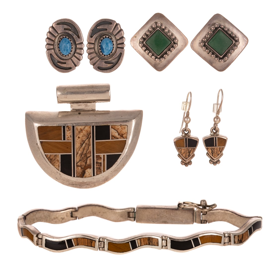 A Group of Jewelry by SuperSmiths, J. Cowboy & More in Sterling Silver: Sterling silver inlaid jewelry set from the Native Earth series by Navajo SuperSmiths Inc., New Mexico, each featuring onyx and jasper inlays, including 1) Bracelet with box clasp and safety latch, 7 