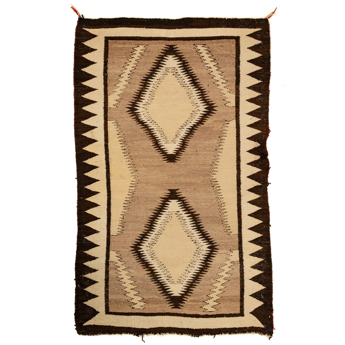 A Navajo Two Gray Hills Rug, 4.6 x 2.10: First half, 20th century, with geometric design in undyed wool, red weft threads