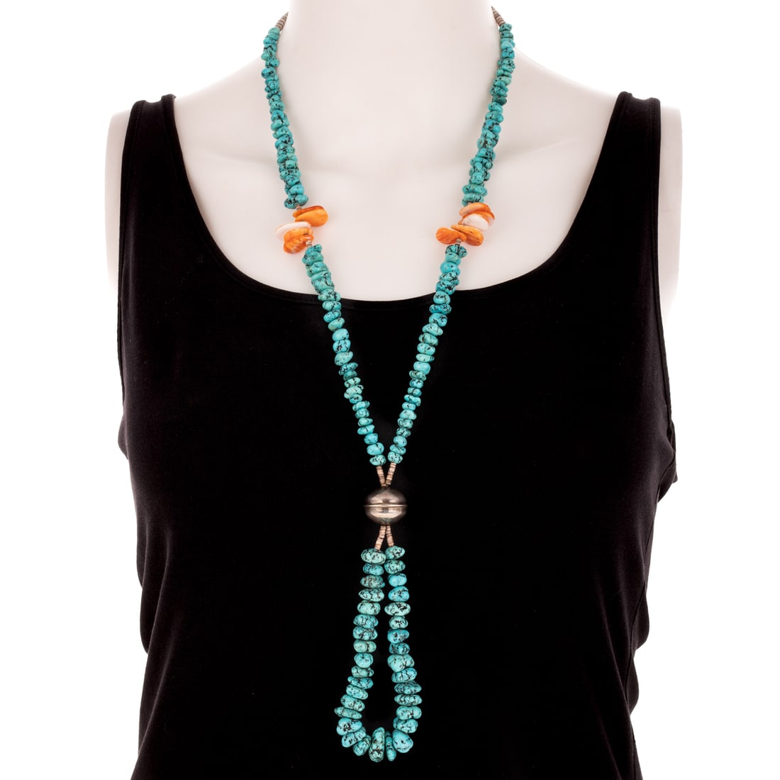 A Southwestern Nugget Turquoise Beaded Necklace in Sterling Silver: Sterling silver accented necklace featuring graduated size nugget turquoise beads in sections alternating with spiny oyster shell beads and one large oval sterling silver bead, hook clasp, 26 in. L, 9