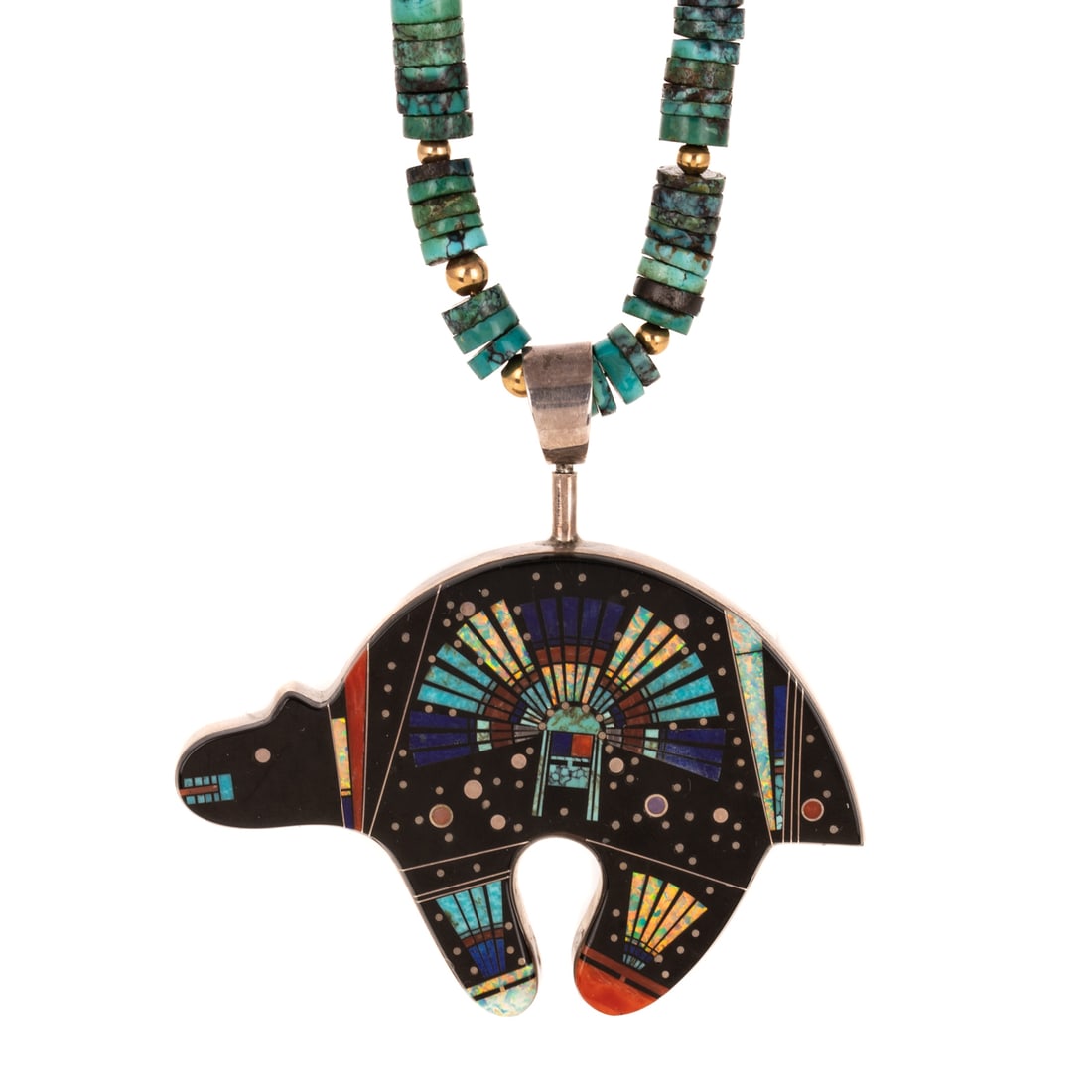 A Navajo Clayton Tom Double Sided Inlaid Necklace in Sterling Silver: Sterling silver double sided micro-inlaid polar bear pendant by Navajo designer Clayton Tom (b. 1970), pendant features micro inlay gemstones including turquoise, coral jet, Mother of Pearl, opal, and